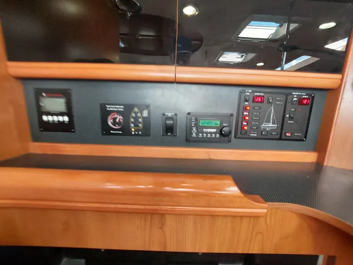"heron" Yacht Photos Pics Control panel inside 2009 Hunter 49 yacht with various electronic displays and switches.