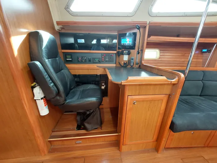 "heron" Yacht Photos Pics 2009 Hunter 49 yacht interior with navigation station and leather chair.