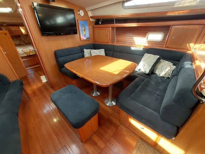 "heron" Yacht Photos Pics Luxurious 2009 Hunter 49 yacht interior with cozy seating and elegant wood finish.
