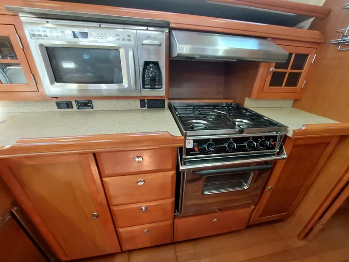 "heron" Yacht Photos Pics 2009 Hunter 49 yacht kitchen with stove, oven, and microwave.