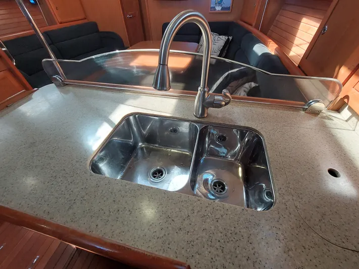 "heron" Yacht Photos Pics Stainless steel sink in 2009 Hunter 49 yacht kitchen interior.