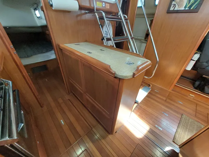 "heron" Yacht Photos Pics Interior of 2009 Hunter 49 sailboat with wooden flooring and cabinetry.