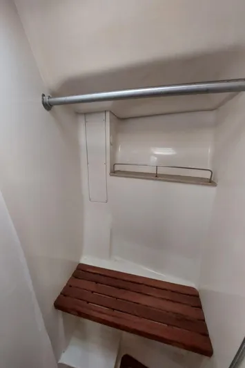 "heron" Yacht Photos Pics 2009 Hunter 49 yacht shower with wooden bench and metal rail.