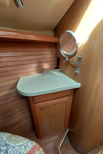"heron" Yacht Photos Pics 2009 Hunter 49 yacht interior with wooden cabinetry and countertop.