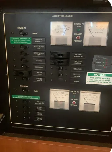 Miracles Yacht Photos Pics Control panel of a 2006 Carver 41 Cockpit Motor Yacht, featuring AC control center.