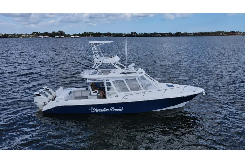 Paradise Bound Yacht Photos Pics 2008 Everglades 350LX boat on water, featuring dual Suzuki engines and "Paradise Bound" text.