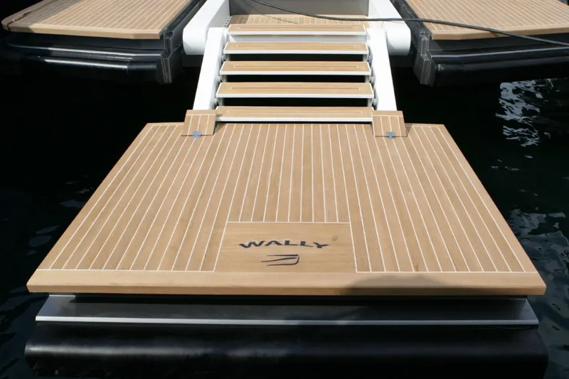  Yacht Photos Pics Wally 55 yacht deck, 2013 model, featuring sleek wooden design and modern aesthetics.