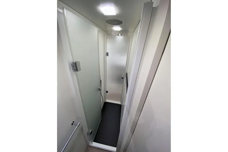  Yacht Photos Pics Compact bathroom interior of 2013 Wally 55 yacht with modern fixtures and frosted glass door.