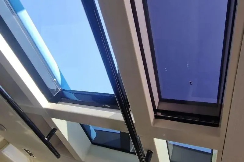  Yacht Photos Pics Skylight view from a 2013 Wally 55 yacht, showcasing modern design and clear blue sky.