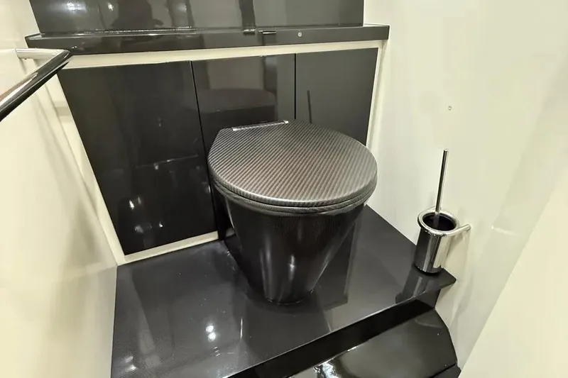  Yacht Photos Pics Luxurious black bathroom in 2013 Wally 55 yacht with modern toilet design.