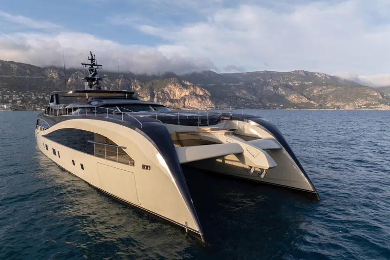 Seawolf X Yacht Photos Pics Luxurious 2024 Rossinavi SEACAT 40 yacht cruising near scenic coastal cliffs.