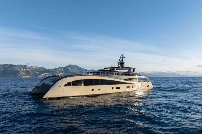 Seawolf X Yacht Photos Pics Luxurious 2024 Rossinavi SEACAT 40 yacht cruising on open sea with scenic mountain backdrop.