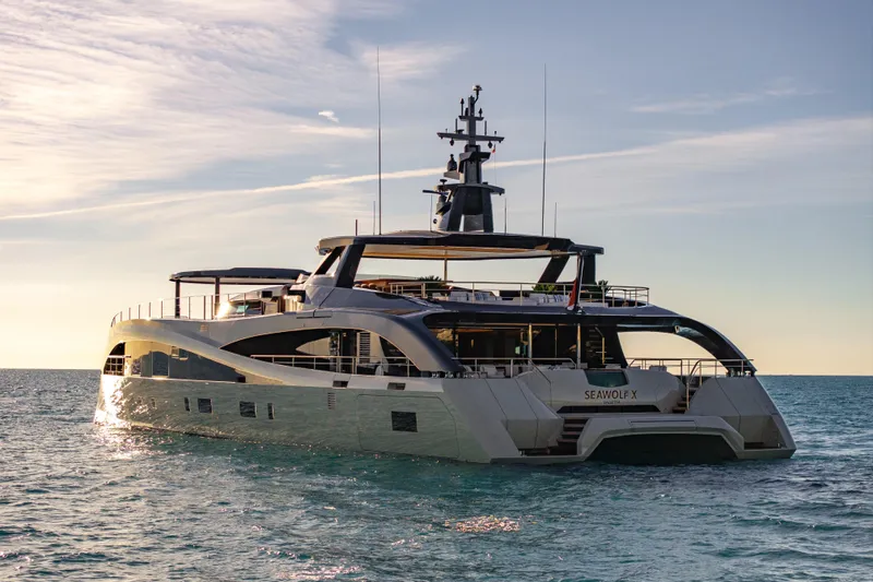 Seawolf X Yacht Photos Pics Luxurious 2024 Rossinavi SEACAT 40 yacht on serene ocean waters at sunset.