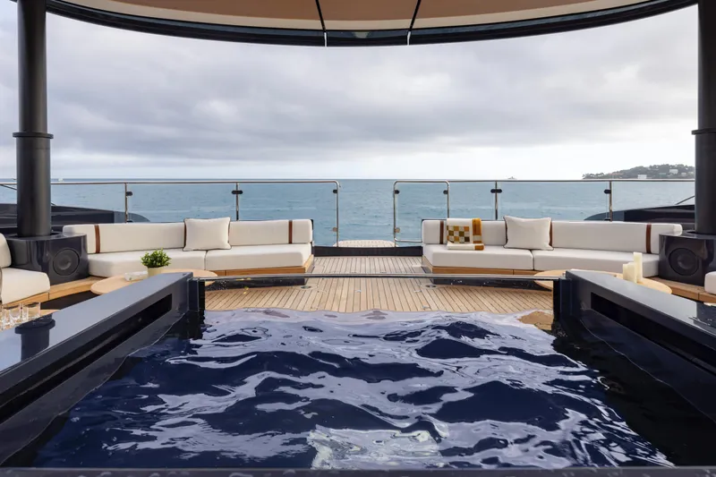 Seawolf X Yacht Photos Pics Luxurious 2024 Rossinavi SEACAT 40 yacht deck with jacuzzi and ocean view.