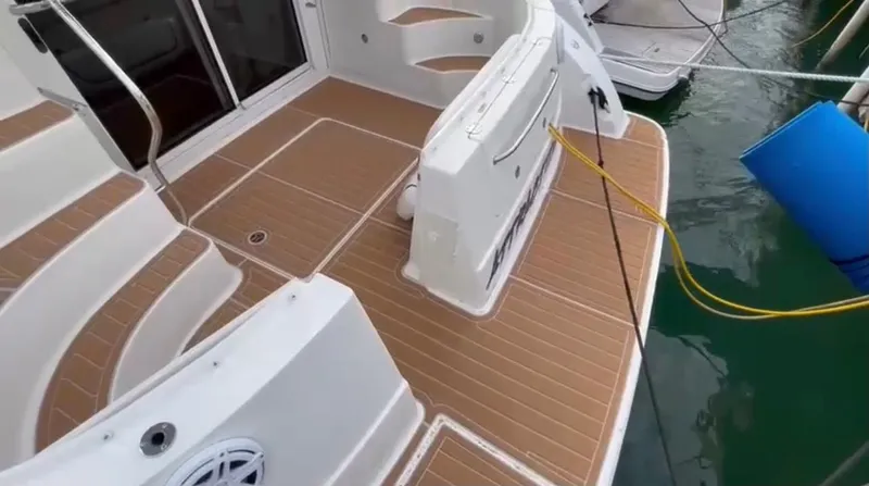  Yacht Photos Pics 2007 Sea Ray 360 Sedan Bridge boat deck with teak flooring and docked at marina.