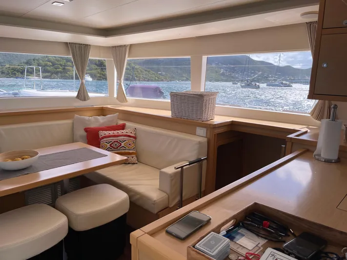 Pasha Yacht Photos Pics Interior of 2012 Lagoon 450F yacht with scenic ocean view through windows.