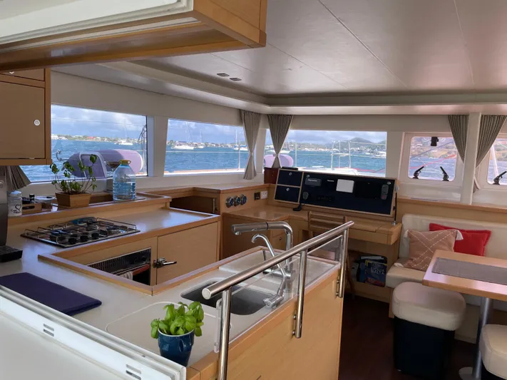 Pasha Yacht Photos Pics Interior of 2012 Lagoon 450F catamaran with modern kitchen and ocean view.