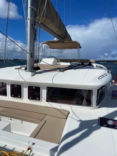 Pasha Yacht Photos Pics 2012 Lagoon 450F catamaran with sails, cruising on a sunny day.