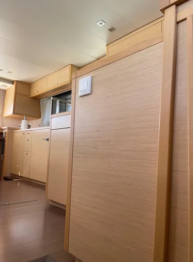 Pasha Yacht Photos Pics Interior of 2012 Lagoon 450F yacht with light wood cabinetry and modern design.