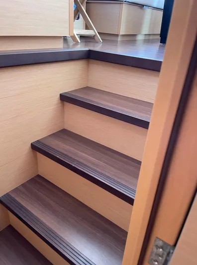 Pasha Yacht Photos Pics Wooden interior stairs on a 2012 Lagoon 450F catamaran.
