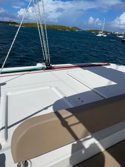 Pasha Yacht Photos Pics Lagoon 450F catamaran deck view, 2012 model, anchored in scenic waters.