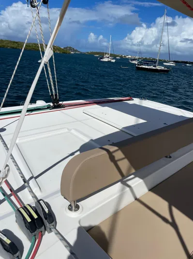 Pasha Yacht Photos Pics 2012 Lagoon 450F catamaran deck with ocean view and sailboats in the background.