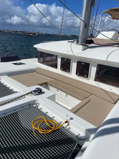 Pasha Yacht Photos Pics Lagoon 450F catamaran deck with seating, netting, and ocean view, 2012 model.