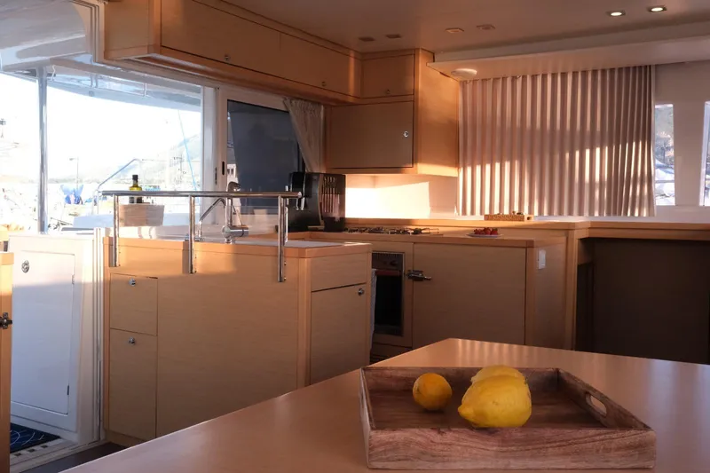 Pasha Yacht Photos Pics Interior of 2012 Lagoon 450F yacht kitchen with lemons on table.
