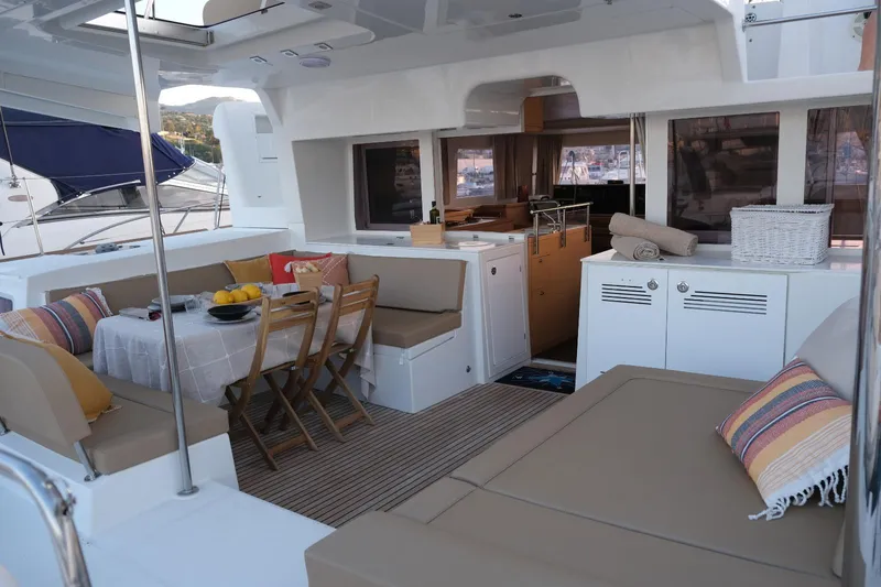 Pasha Yacht Photos Pics Luxurious 2012 Lagoon 450F yacht interior with cozy seating and dining area.