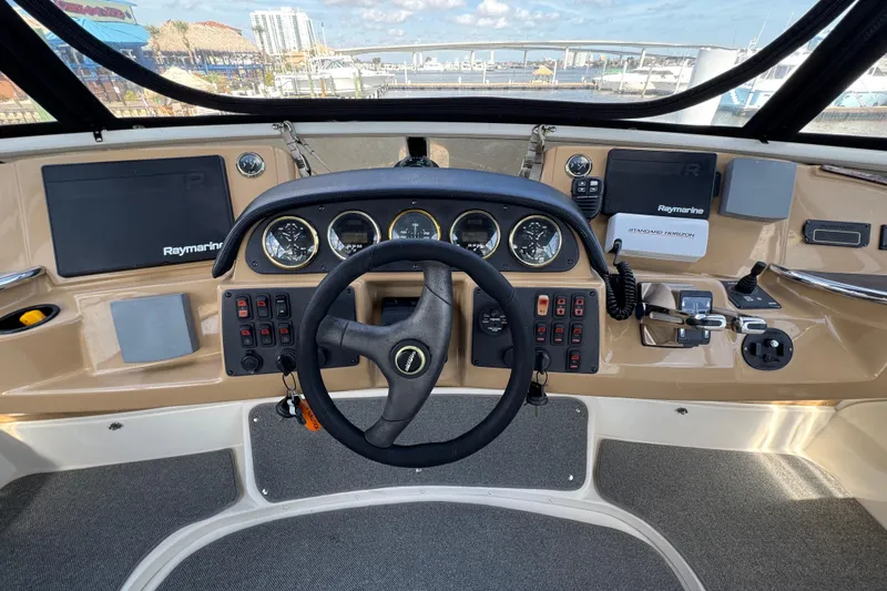  Yacht Photos Pics Cockpit view of 2004 Carver 444 Cockpit Motor Yacht with steering wheel and navigation instruments.