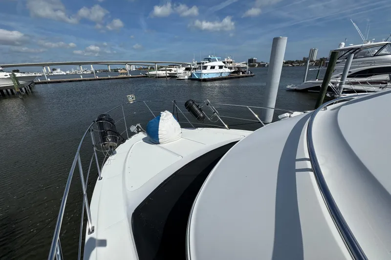  Yacht Photos Pics 2004 Carver 444 Cockpit Motor Yacht docked at marina under blue sky.