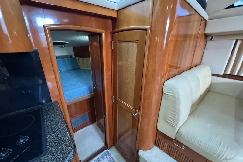  Yacht Photos Pics Interior of 2004 Carver 444 Cockpit Motor Yacht with wood finish and cozy seating.