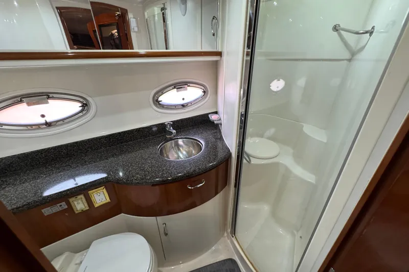  Yacht Photos Pics Luxurious bathroom in 2004 Carver 444 Cockpit Motor Yacht with shower and granite countertop.