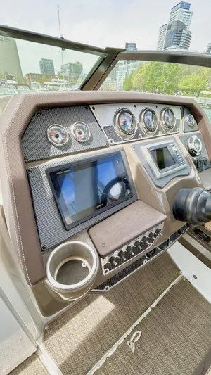  Yacht Photos Pics 2014 Cruisers Sport Series 328 Bow Rider dashboard with gauges and navigation screen.