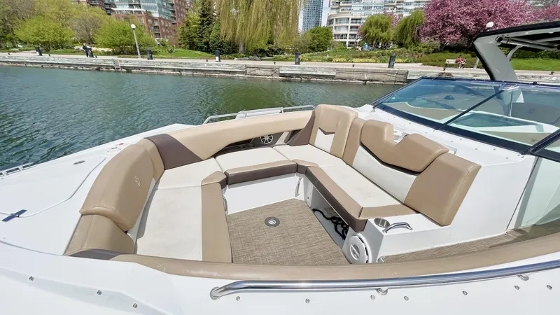  Yacht Photos Pics 2014 Cruisers Sport Series 328 Bow Rider with spacious seating on a sunny day.