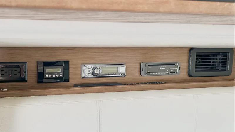  Yacht Photos Pics Control panel of 2014 Cruisers Sport Series 328 Bow Rider with audio and ventilation systems.