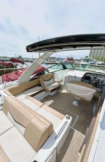  Yacht Photos Pics 2014 Cruisers Sport Series 328 Bow Rider with spacious seating and modern dashboard.