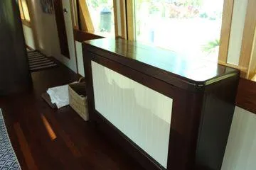  Yacht Photos Pics Interior of 1983 Cheoy Lee 90 cockpit motor yacht with wooden cabinetry.