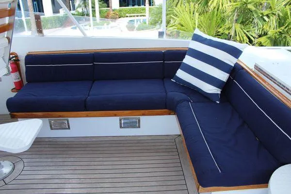  Yacht Photos Pics Luxurious seating area on 1983 Cheoy Lee 90 cockpit motor yacht with blue cushions.