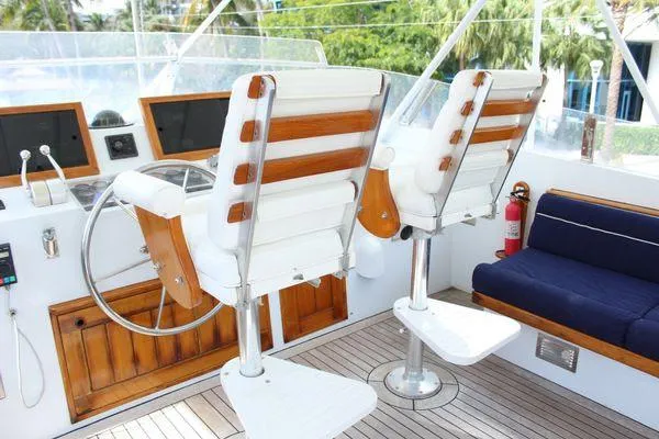  Yacht Photos Pics Cockpit of 1983 Cheoy Lee 90 motor yacht with helm chairs and navigation equipment.