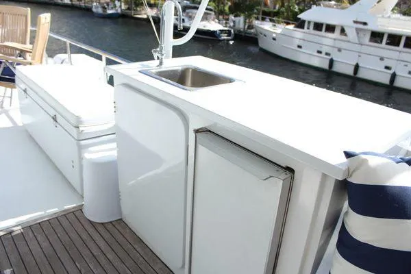  Yacht Photos Pics Cheoy Lee 90 cockpit motor yacht 1983, featuring outdoor sink and seating area.