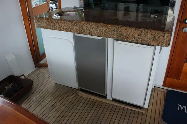  Yacht Photos Pics Granite countertop and cabinets on 1983 Cheoy Lee 90 cockpit motor yacht.