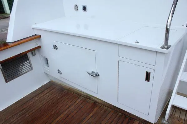  Yacht Photos Pics 1983 Cheoy Lee 90 cockpit motor yacht, white cabinetry, wooden deck, sleek design.