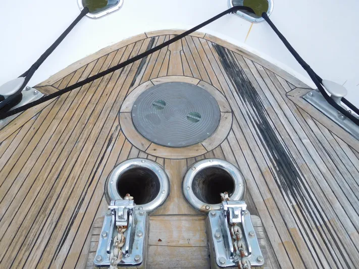  Yacht Photos Pics 1983 Cheoy Lee 90 cockpit motor yacht deck with anchor chain ports.