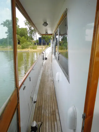  Yacht Photos Pics Side deck of 1983 Cheoy Lee 90 cockpit motor yacht with wooden flooring.