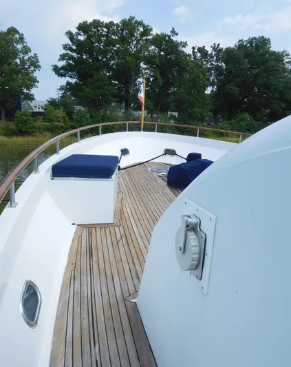  Yacht Photos Pics 1983 Cheoy Lee 90 cockpit motor yacht deck with wooden flooring and seating.