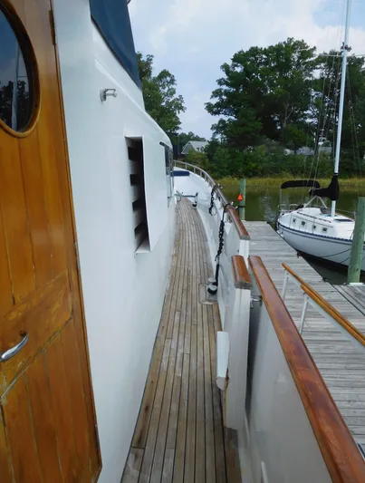  Yacht Photos Pics 1983 Cheoy Lee 90 cockpit motor yacht docked, featuring wooden deck and sleek design.