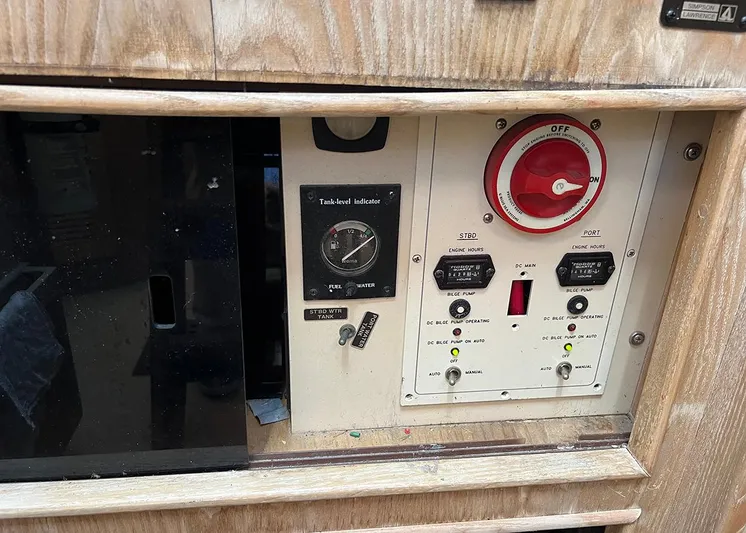  Yacht Photos Pics Control panel of a 1998 Island Packet Cat 35 sailboat, featuring gauges and switches.