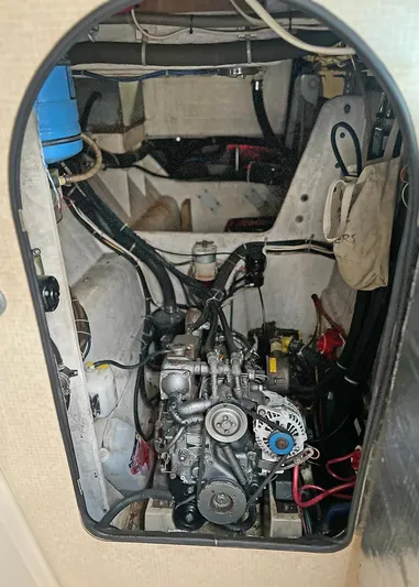  Yacht Photos Pics Engine compartment of a 1998 Island Packet Cat 35 sailboat, showcasing mechanical components.
