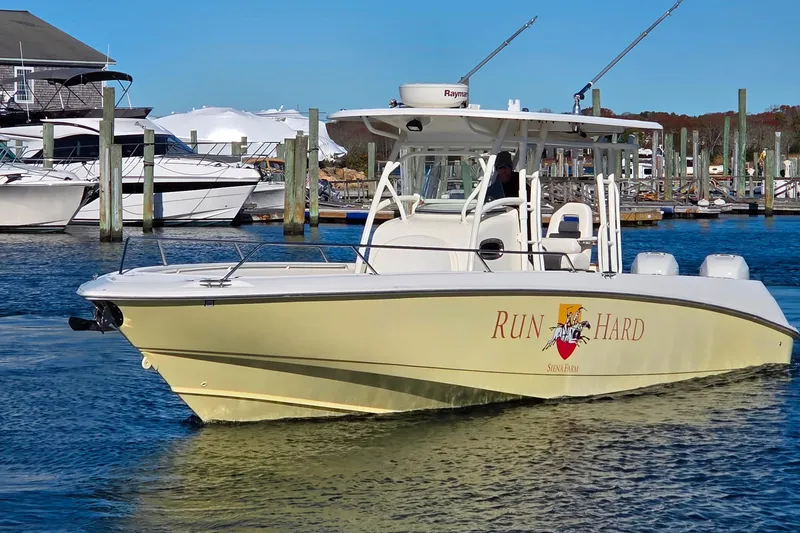  Yacht Photos Pics 2013 Boston Whaler 320 Outrage boat docked in marina, featuring "Run Hard" logo.
